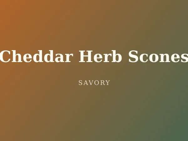 Cheddar Herb Scones — a scone split open to show pockets of melted sharp cheddar