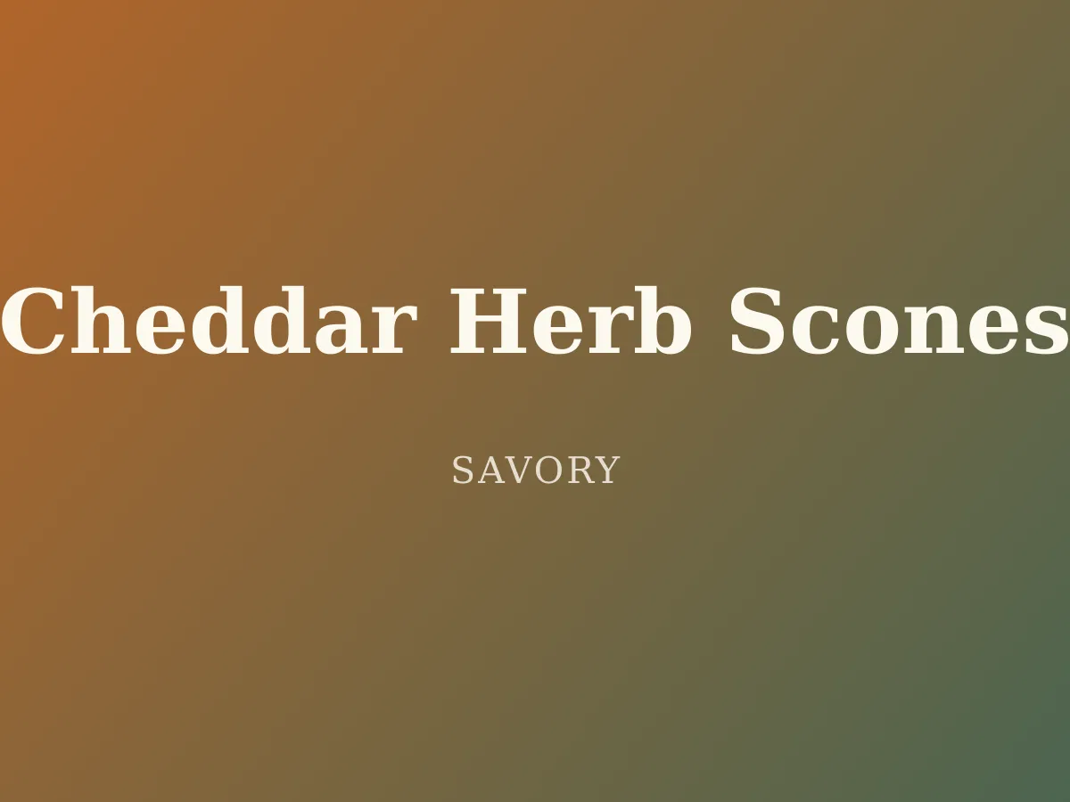 Cheddar Herb Scones — golden triangular scones flecked with cheddar and fresh herbs